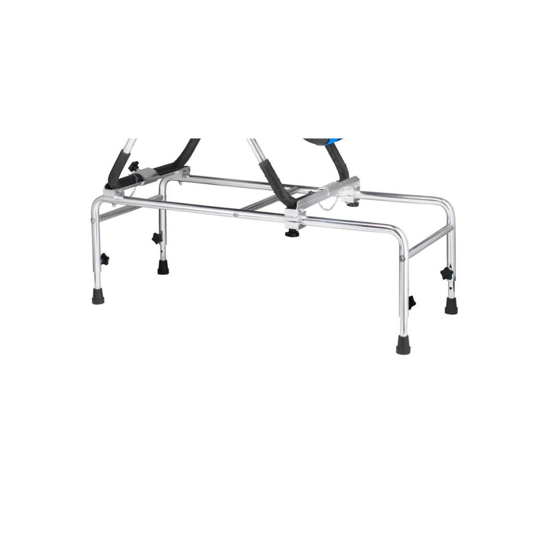 The Anchor Tub Stand for Anchor Bath Chair features a silver metal base with four black rubber-tipped legs, height-adjustable minimalistic tubular frame, and secure connection points to support and stabilize the bath chair.